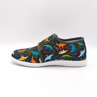 Coccole | Slip on in tela con velcro blu con dinosauri